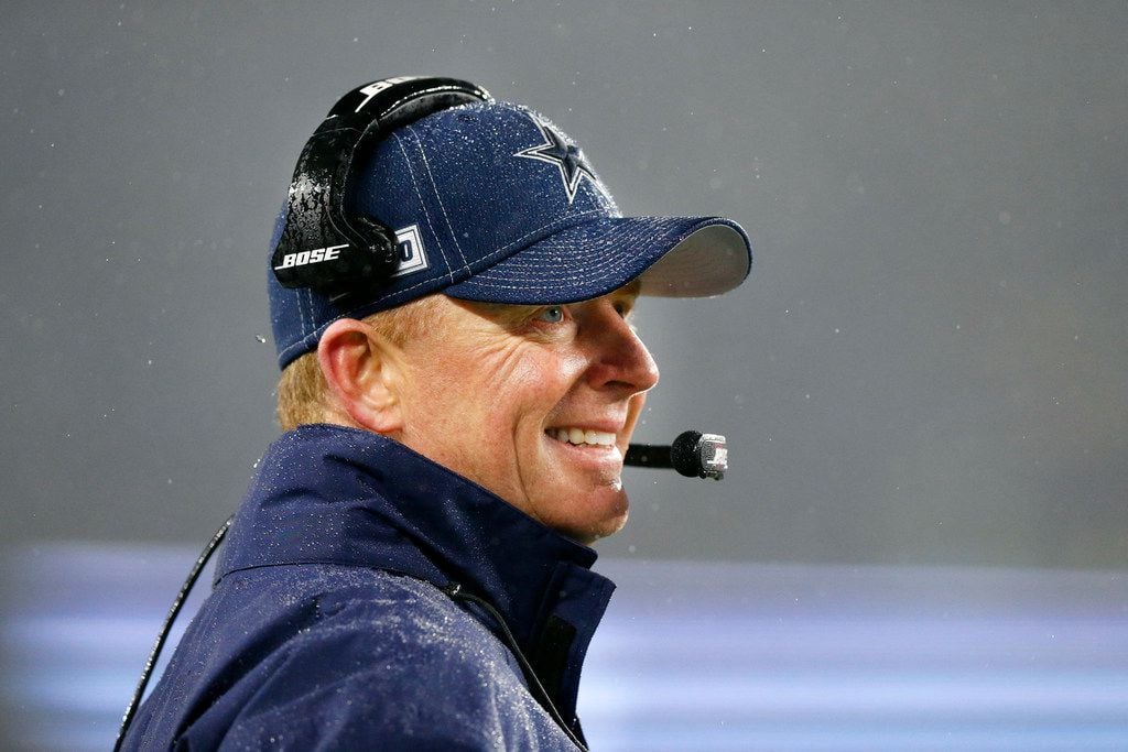 Dallas Cowboys head coach Jason Garrett watches his offense in a gusty rain at Gillette...