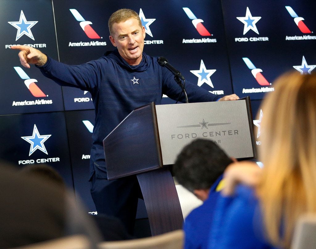 Dallas Cowboys head coach Jason Garrett responds to a question during a press conference at...