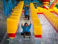 Carla Lule tries out the ice slide at the "Ice!" exhibit in 2019 at the Gaylord Texan Resort.
