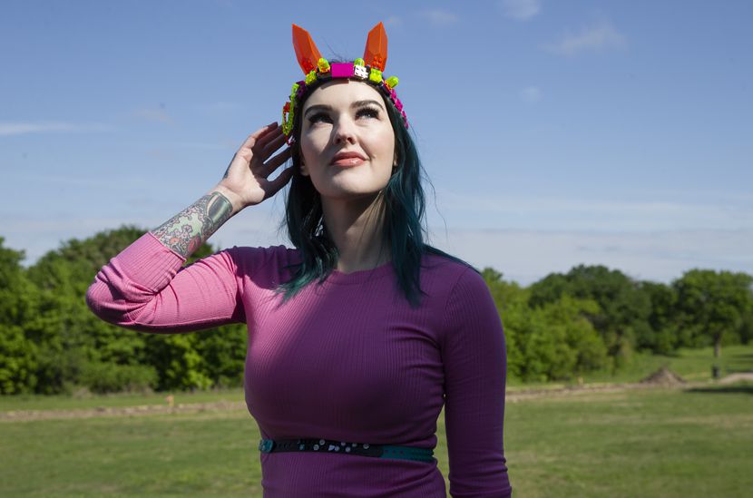Amie Dansby wears a Lego cat ears hairband and a belt she made herself. The Dallas area...