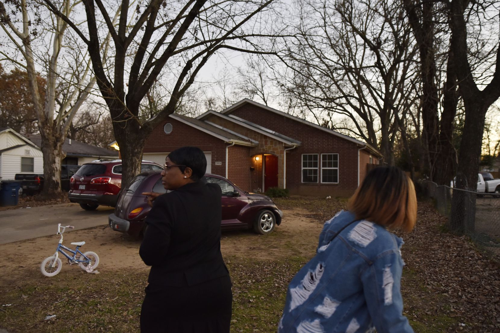 Ella Mae Beasley, 57, left, and her niece walked by the home where 1-year-old Rory Norman was shot and killed early Sunday morning on Valentine Street in South Dallas, Jan. 5, 2020. So far there have been four murders in 2020. 