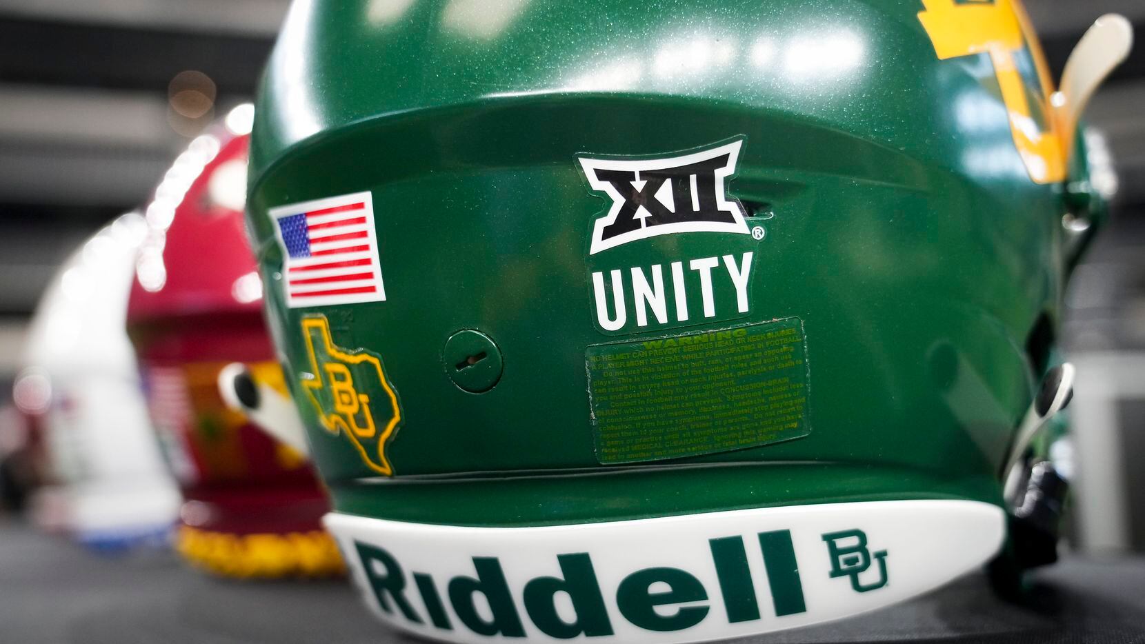 A sticker reads “unity” under the Big 12 logo on a Baylor helmet displayed during the Big 12...