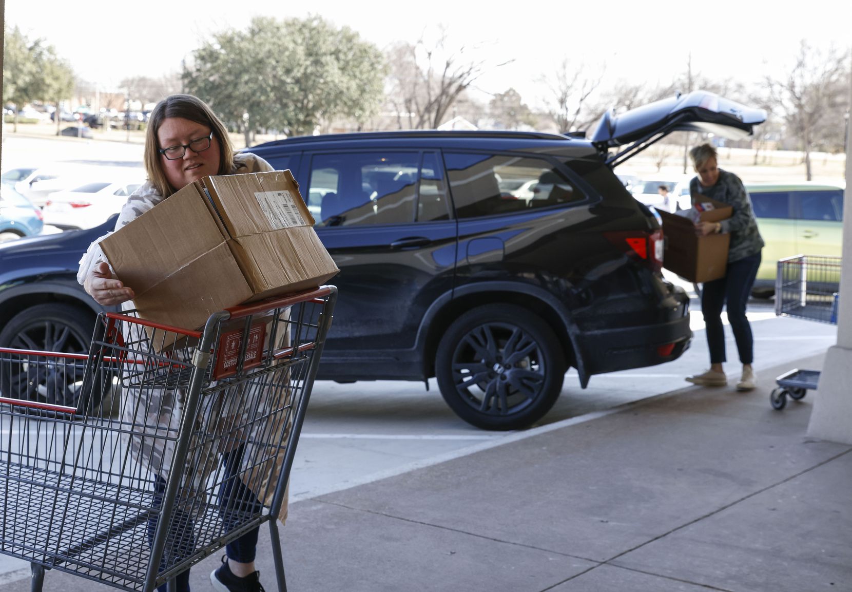 Whitney Hicks (left) and Julie Coalson from Christie Elementary School in Frisco drop...