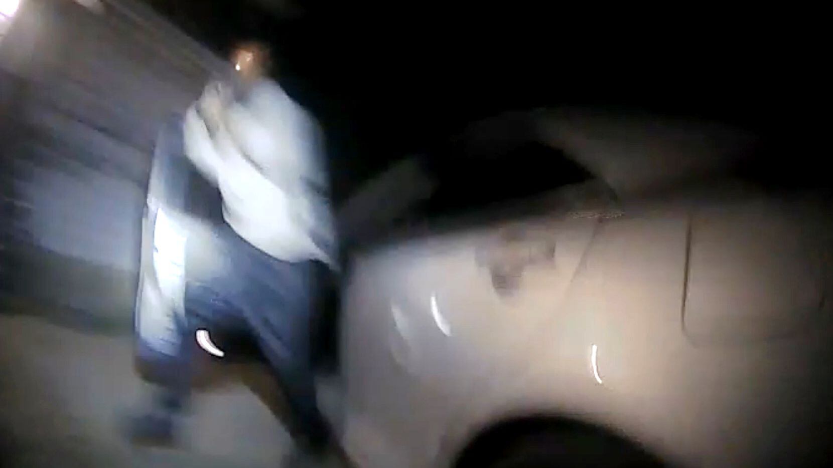 A video frame grab shows Schaston Hodge as he emerges from his car holding a gun on Aug. 17, 2019. The DPS troopers were working with DPD officers to tackle crime as a part of Operation D-Town. The videoÕs release comes after The News obtained the autopsy report, which showed Hodge was shot 16 times -- five times in front and four times in the back.