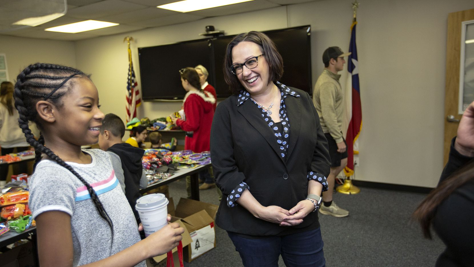 MJ Hegar chats with Azaria Jordan, 9, and her stepmother, Staff Sgt. Selina Robinson during...
