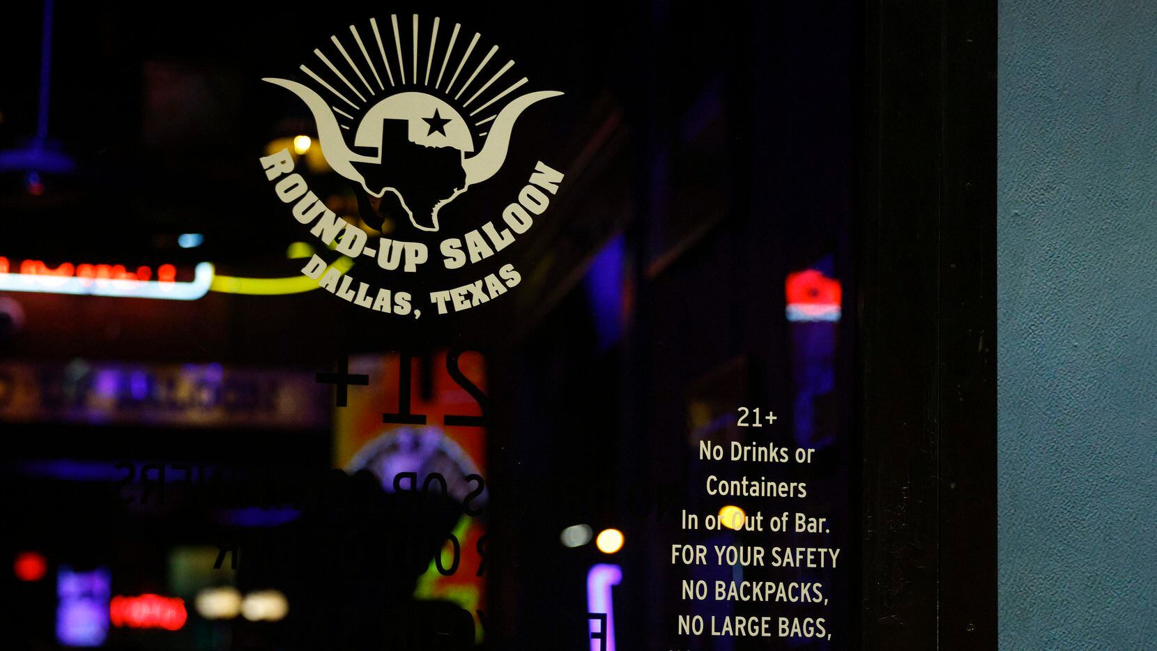 A sign on the door of Round-Up Saloon tells patrons that large bags are not allowed in the...