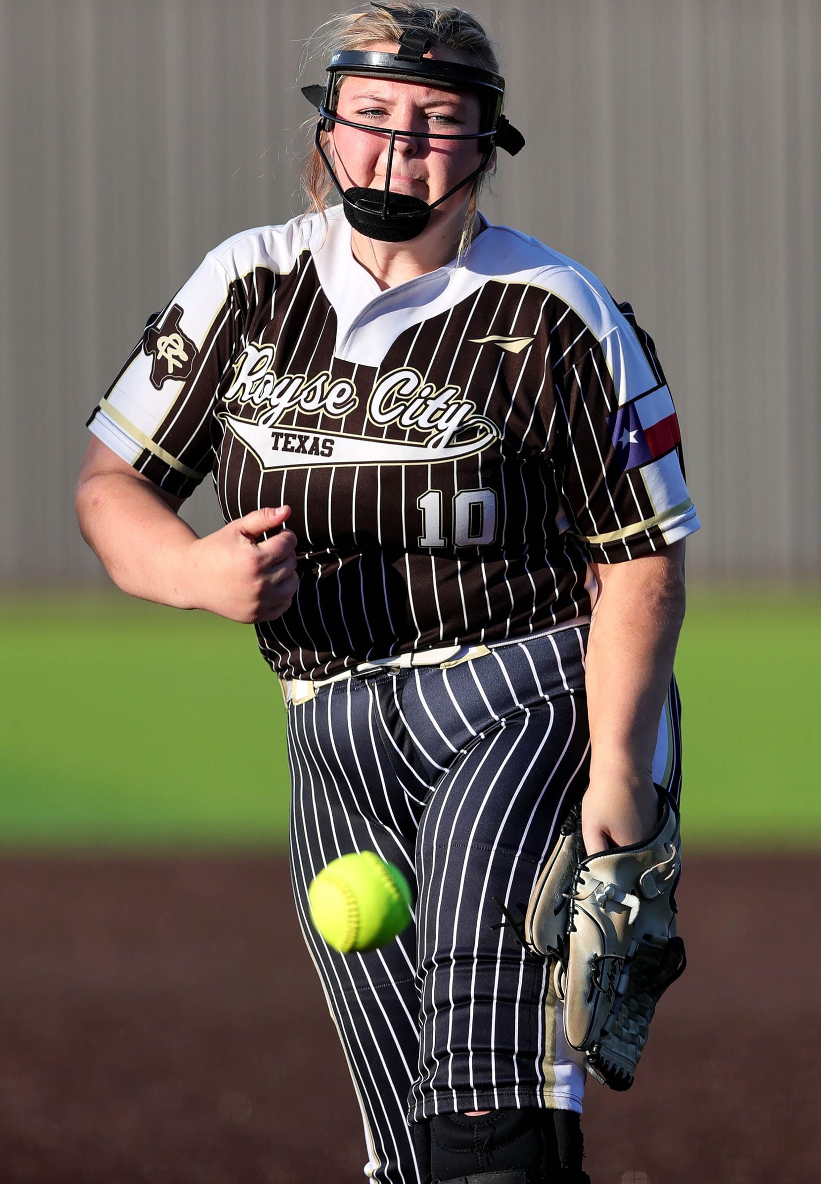 Royce City starting pitcher Kaylee Schmitz delivers a pitch to Prosper Rock Hill during game...