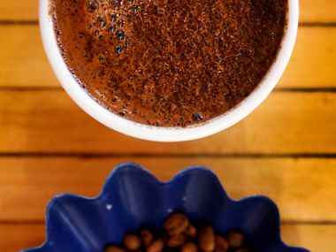 Ascension Coffee beans and a fresh made cup is prepared for cupping at the headquarters in...