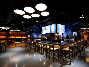 The front bar area is pictured at the new Stadium Club restaurant in AT&T Stadium, Friday,...