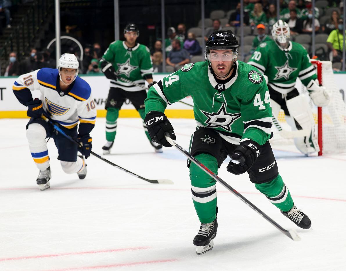 Dallas Stars defenseman Joel Hanley (44) goes for the puck during the second period of a Dallas Stars preseason game against St. Louis Blues on Tuesday, Oct. 5, 2021, at American Airlines Center in Dallas. (Juan Figueroa/The Dallas Morning News)