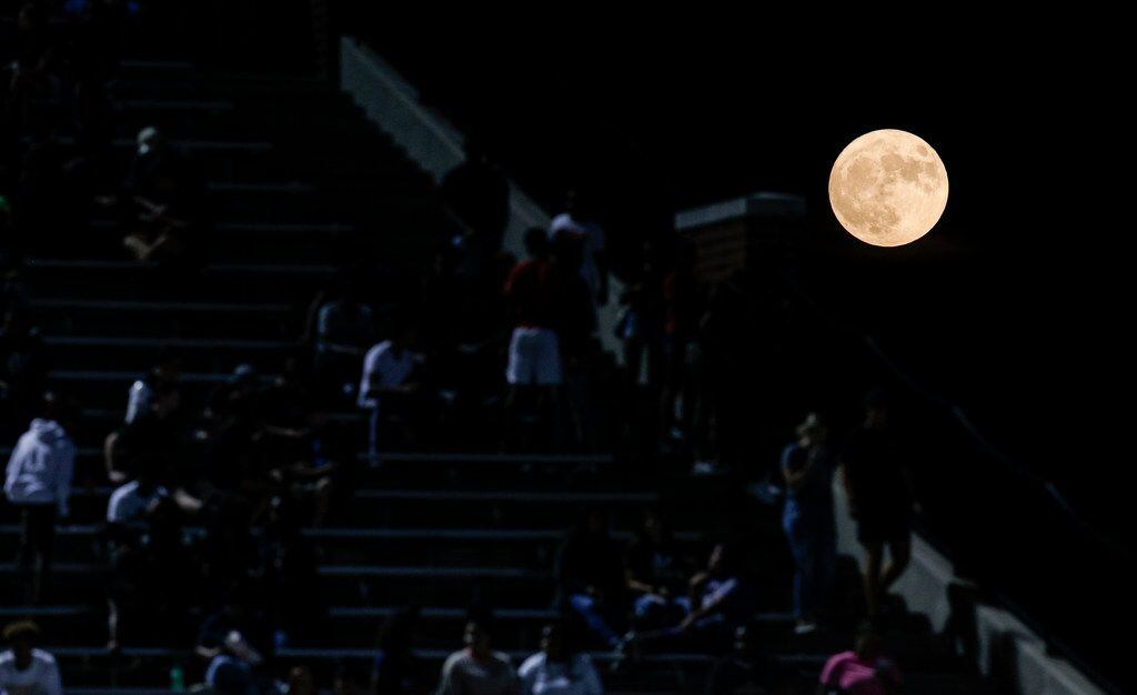 TXHSFB A full moon rises over Vernon Newsom Stadium during the first half of a high school...
