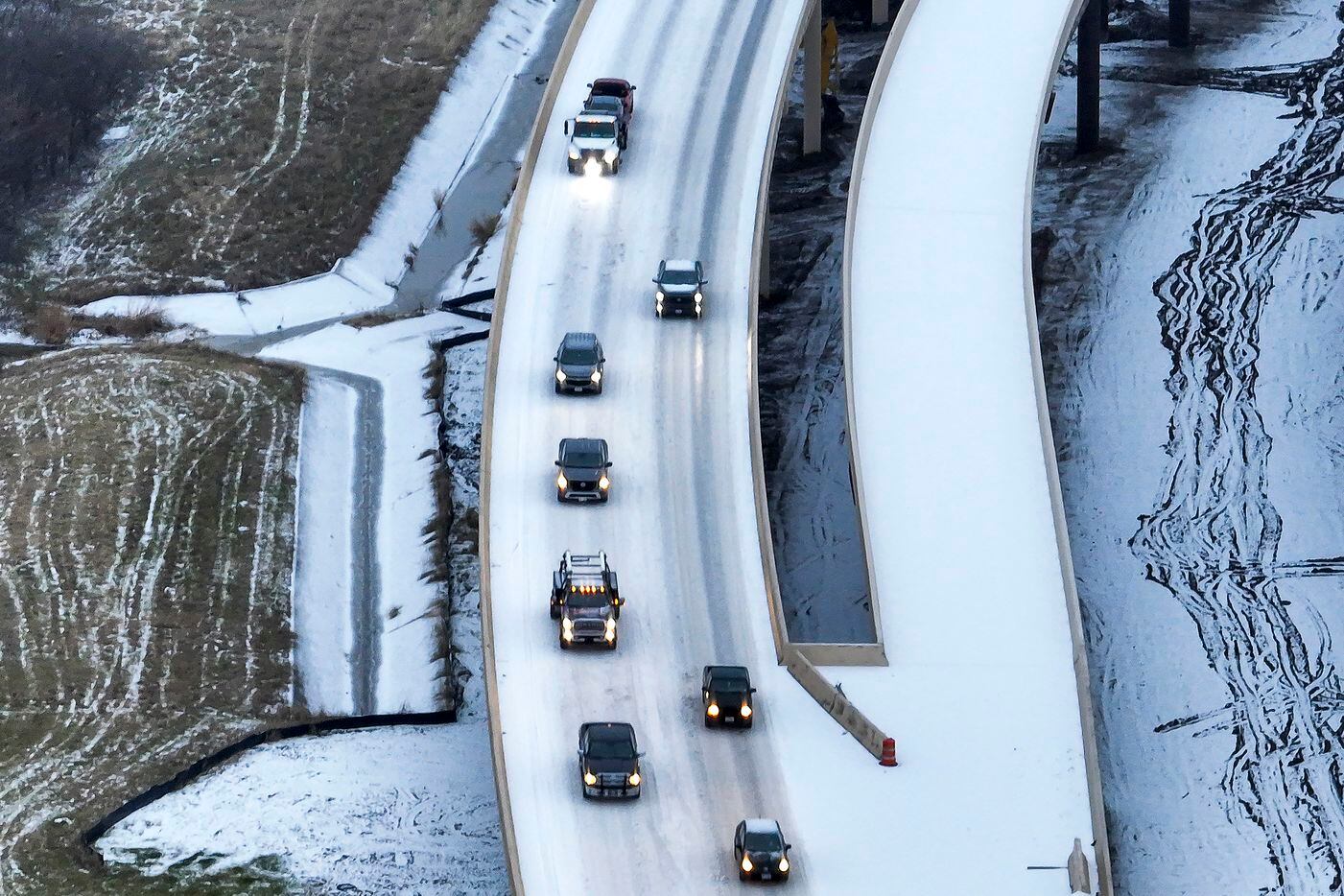 An icy mix covers Highway 114 on Monday, Jan. 30, 2023, in Roanoke. Dallas and other parts...