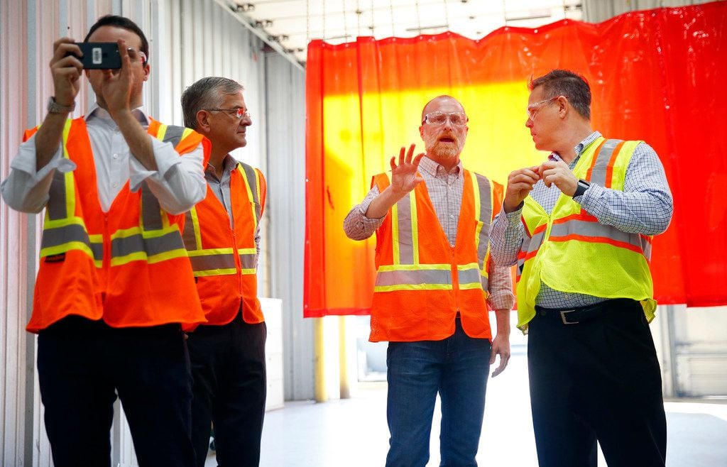 Federal Communications Commission member Brendan Carr (second from right) tours wireless...