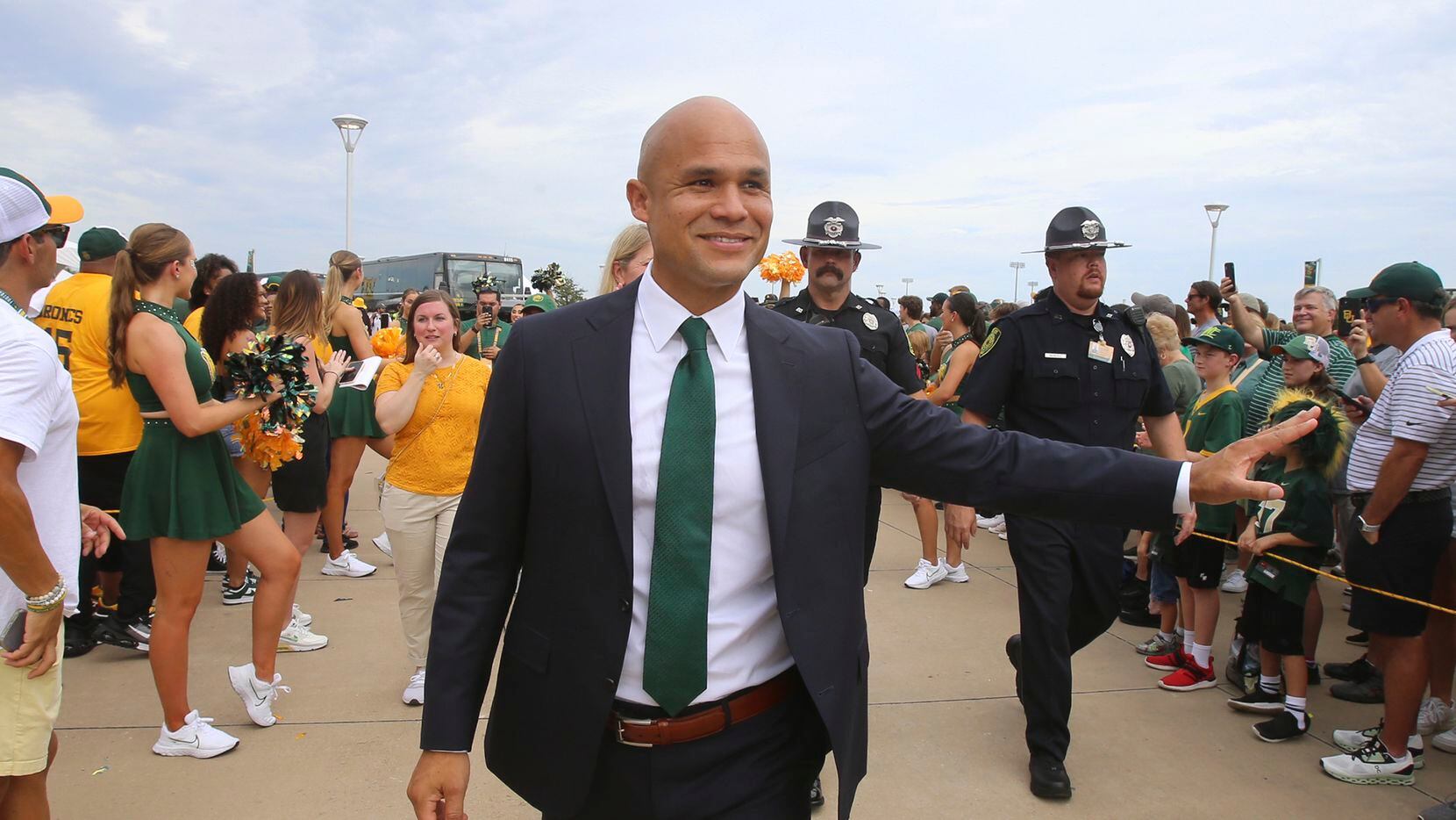 Baylor head coach Dave Aranda waves to fans before an NCAA college football game with Baylor...