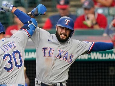 Texas Rangers' Isiah Kiner-Falefa, right, congratulates Nathaniel Lowe after Lowe hit a three-run home run in the first inning of a baseball game against the Cleveland Indians, Tuesday, Aug. 24, 2021, in Cleveland. (AP Photo/Tony Dejak)