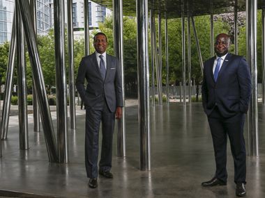 Fred Perpall (left), chairman of the Dallas Citizens Council and CEO of The Beck Group, and John Olajide, chairman of the Dallas Regional Chamber and CEO of Axxess, posed for a photograph on July 7 at Klyde Warren Park in Dallas.