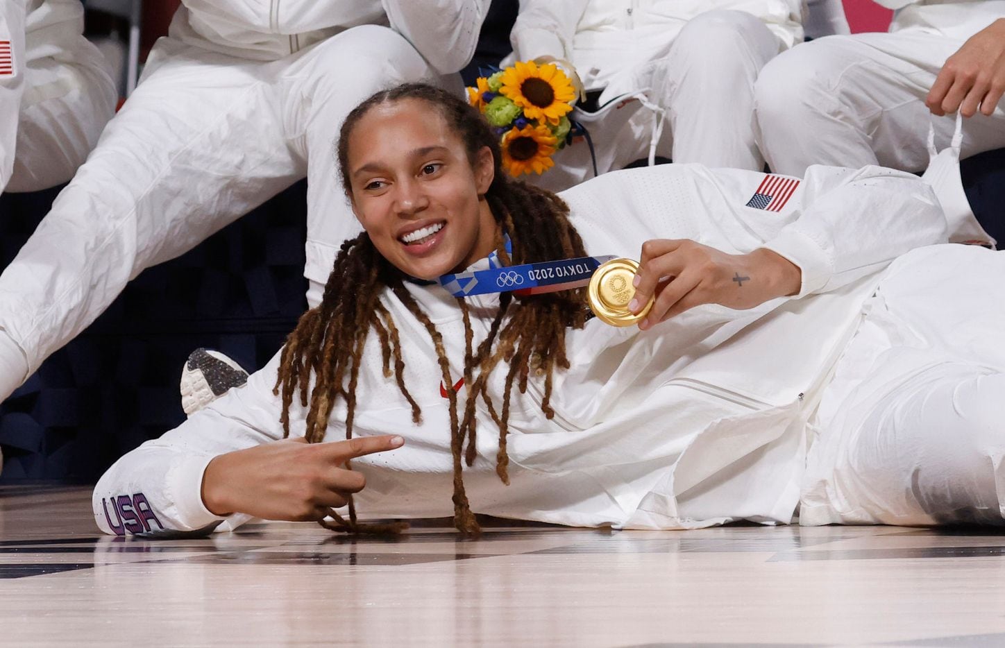 USA’s Brittney Griner (15) and team pose for photos during the medal ceremony for the...