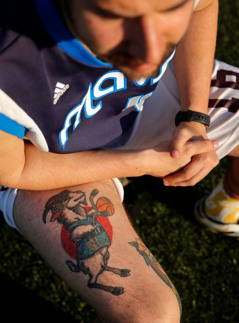 Mark Campbell displays his tattoo of the GOAT (Greatest of All Time) and Dallas Mavericks...