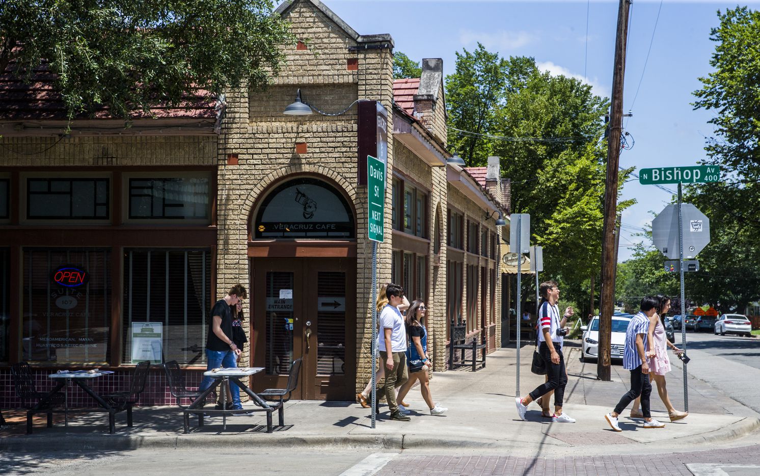 People walked among the shops and restaurants in the Bishop Arts District in June 2017.