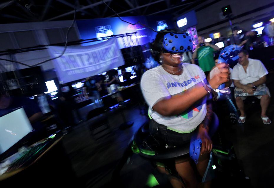 Summer Lolly enjoys a virtual reality game during DreamHack in Bailey Hutchison ...