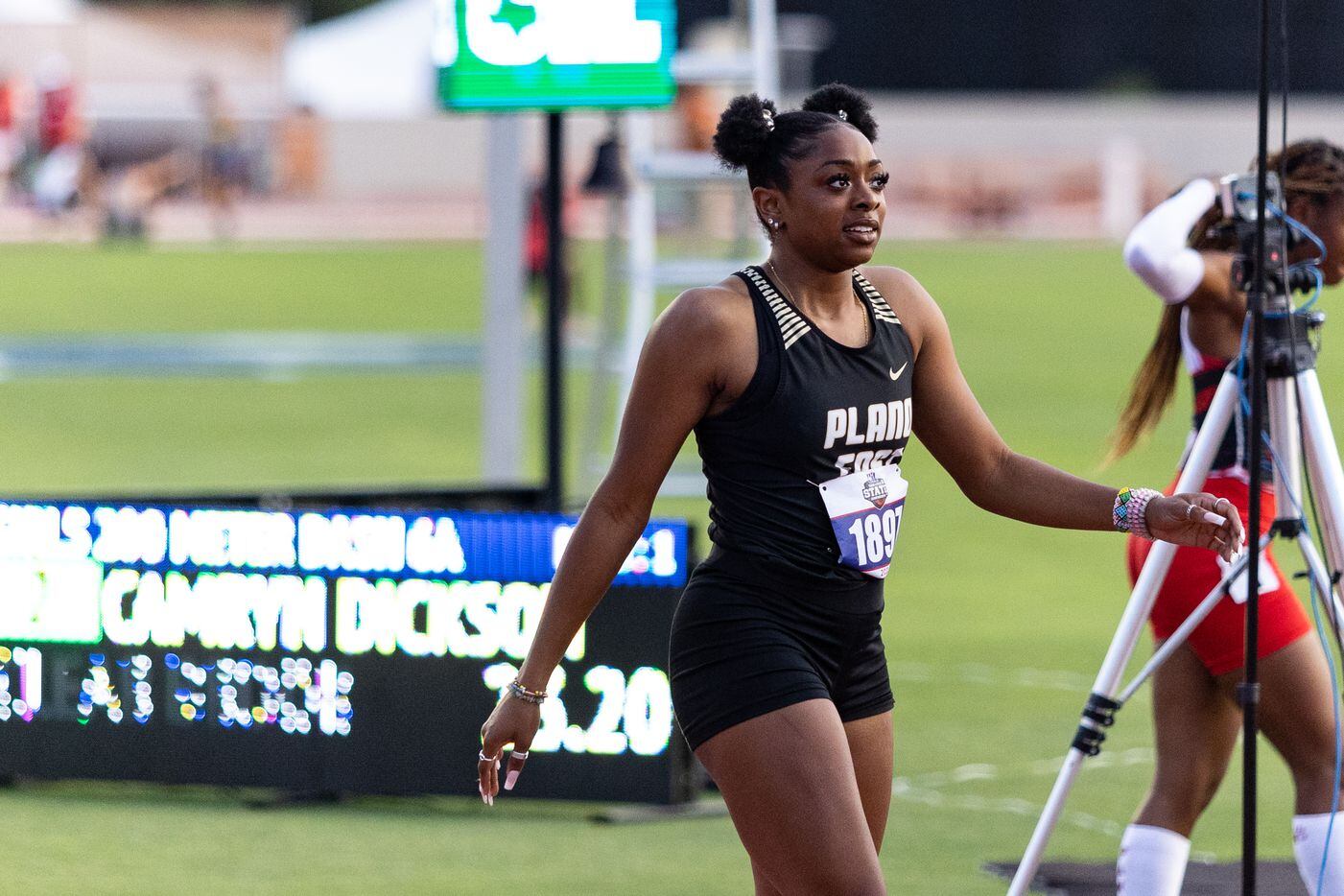 Tiriah Kelley of Plano East reacts after winning the girls’ 200-meter dash at the UIL Track...