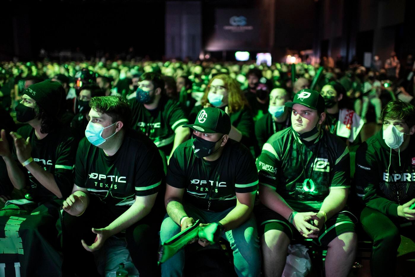 Erick Lindao, center, watches in anticipation with other fans as OpTic Texas competes...