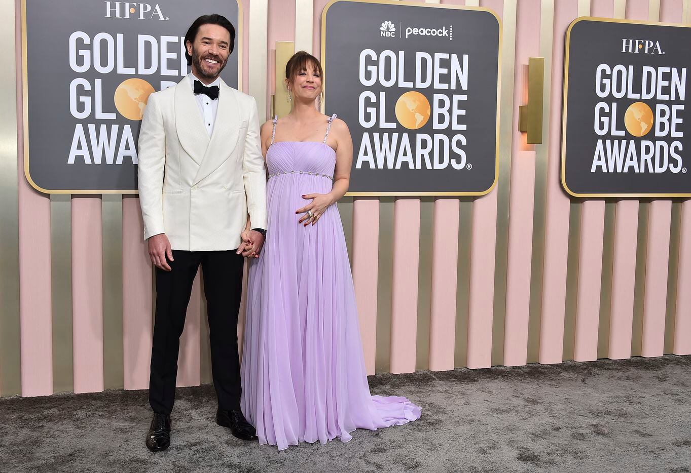 Tom Pelphrey, left, and Kaley Cuoco arrive at the 80th annual Golden Globe Awards at the...