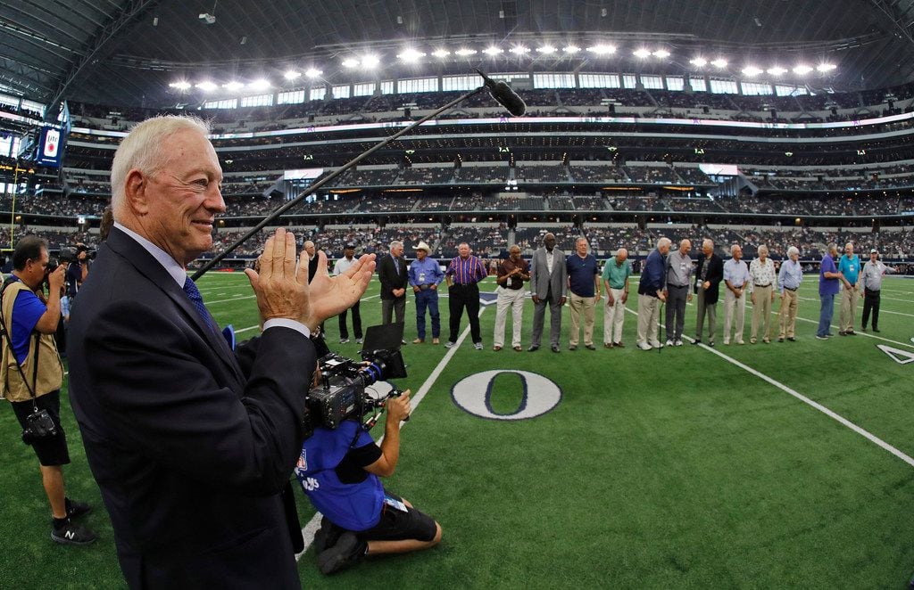 Cowboys owner Jerry Jones clapped for members of the 1967 Cowboys team before the Los...