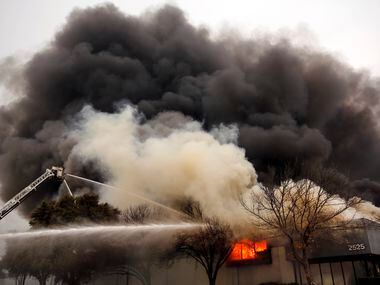 Fort Worth firefighters battle a large 5-alarm fire at the Advanced Foam Recycling facility...