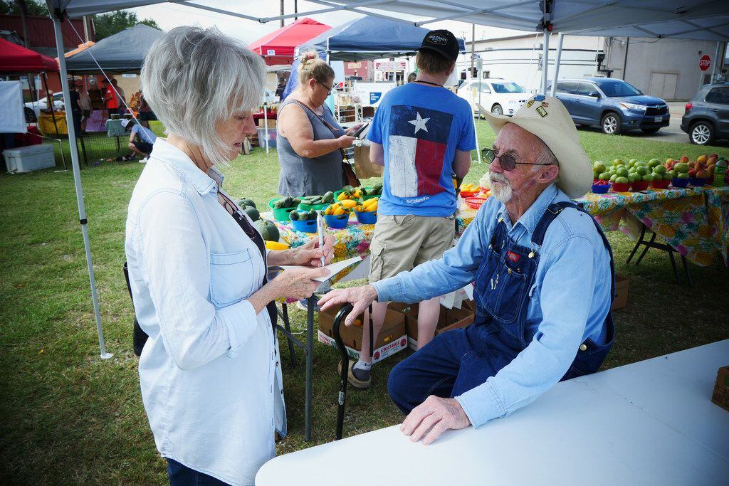 Reporter Kim Pierce visits with J.T. Lemley at the Downtown Canton Farmers Market, which is...
