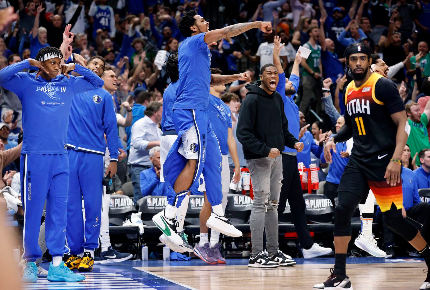 The Dallas Mavericks bench reacts to a there-pointer by forward Maxi Kleber during the third...