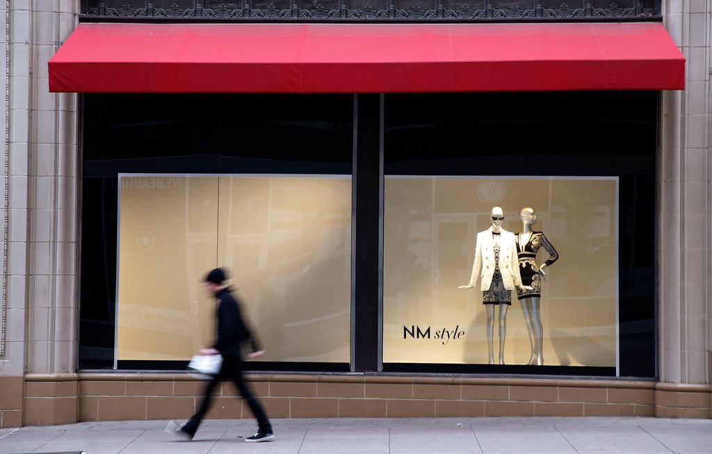 A man walks by the Neiman Marcus store in downtown Dallas.