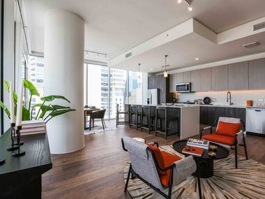Kitchen and living room in a 2 beds 2 bath apartment at The Victor. (Lola Gomez / The Dallas...