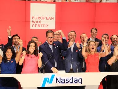 European Wax Center CEO David Berg (Center) celebrated the start of trading for EWCZ shares on the Nasdaq Thursday, Aug. 5, 2021.