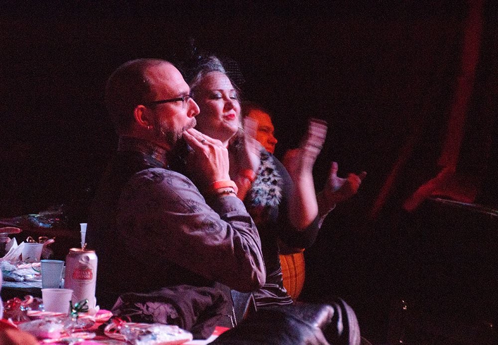 A couple cheers on the performers at the burlesque show Saturday night.