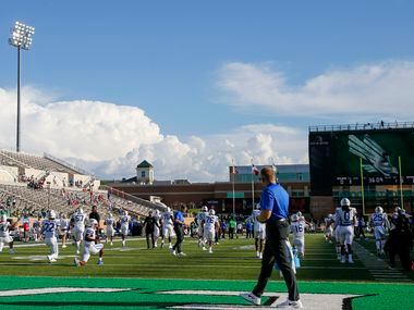 SMU players warm-up before a game against UNT at Apogee Stadium in Denton, Saturday, Sept....