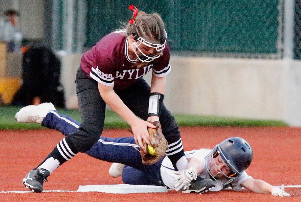 Wylie third baseman Averie Gunther tags out McKinney Boyd's Reagan Sommers (8) at third base on a stolen base attempt in the third inning of Wylie's 4-3, 10-inning win Thursday.  (Stewart F. House/Special Contributor)