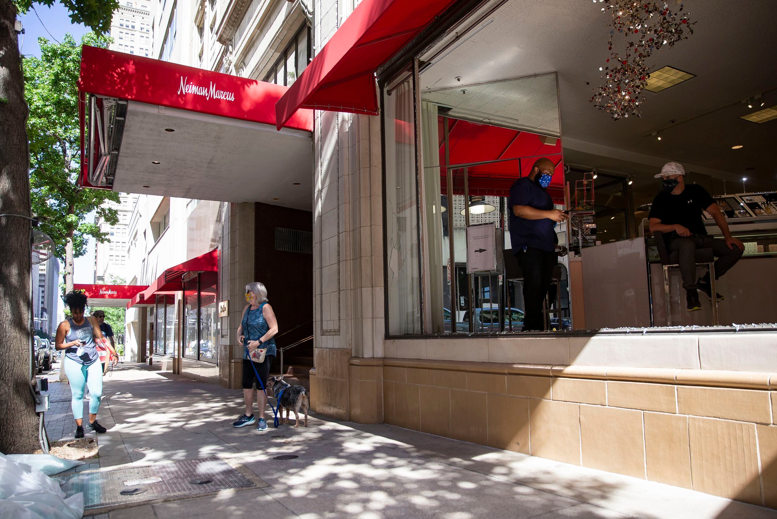 Neiman Marcus storefront with broken windows on Commerce St. Saturday morning, May 30, 2020,...