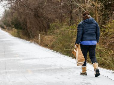 Laura Baker walks at the Santa Fe Trail at White Rock Lake in Dallas on Wednesday, Feb. 1,...