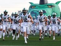 The Southlake Carroll Dragons enter the field to face Flower Mound Marcus in a high school...