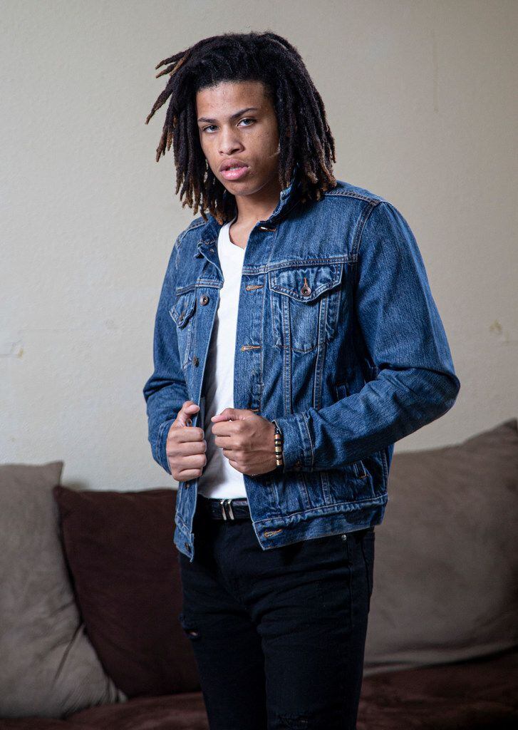 Kerion Washington, 17, shows off a modeling pose he recently learned from his modeling...