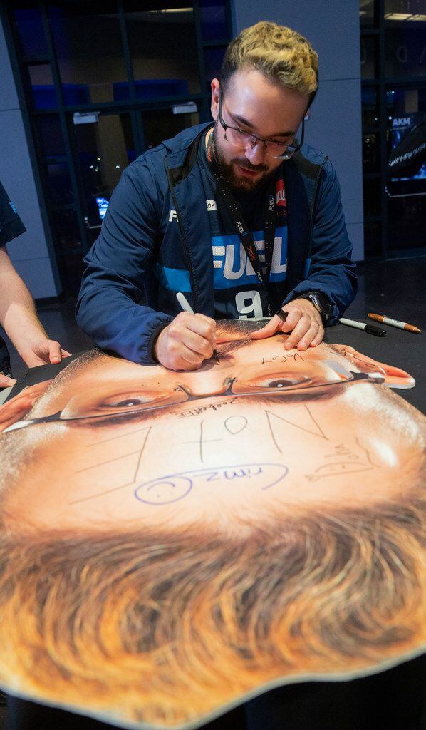 Andrew Fugitt holds a cutout of Wonsik 'Closer' 'Jung of the Dallas Fuel during the season three opening weekend  match of the Overwatch League against the San Francisco Shock on Feb. 9, 2020 at the Esports Stadium in Arlington. The Fuel lost 3-1. (Juan Figueroa/ The Dallas Morning News)