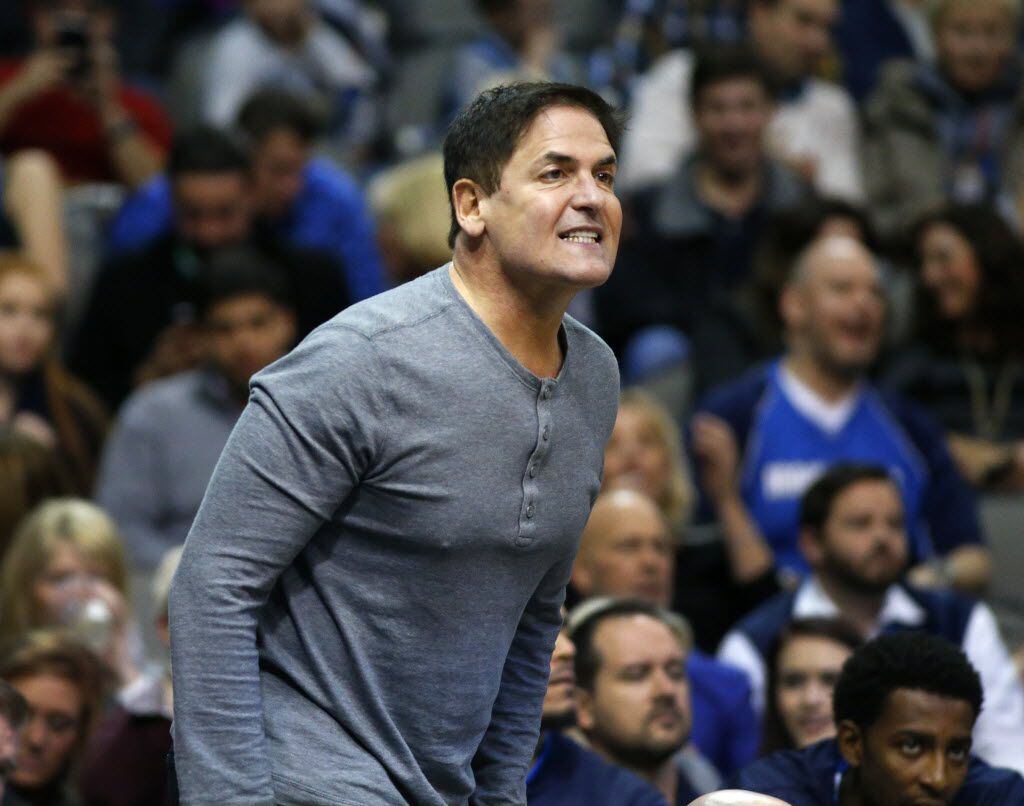 Dallas Mavericks owner Mark Cuban reacts to the play on the court in the second half against...
