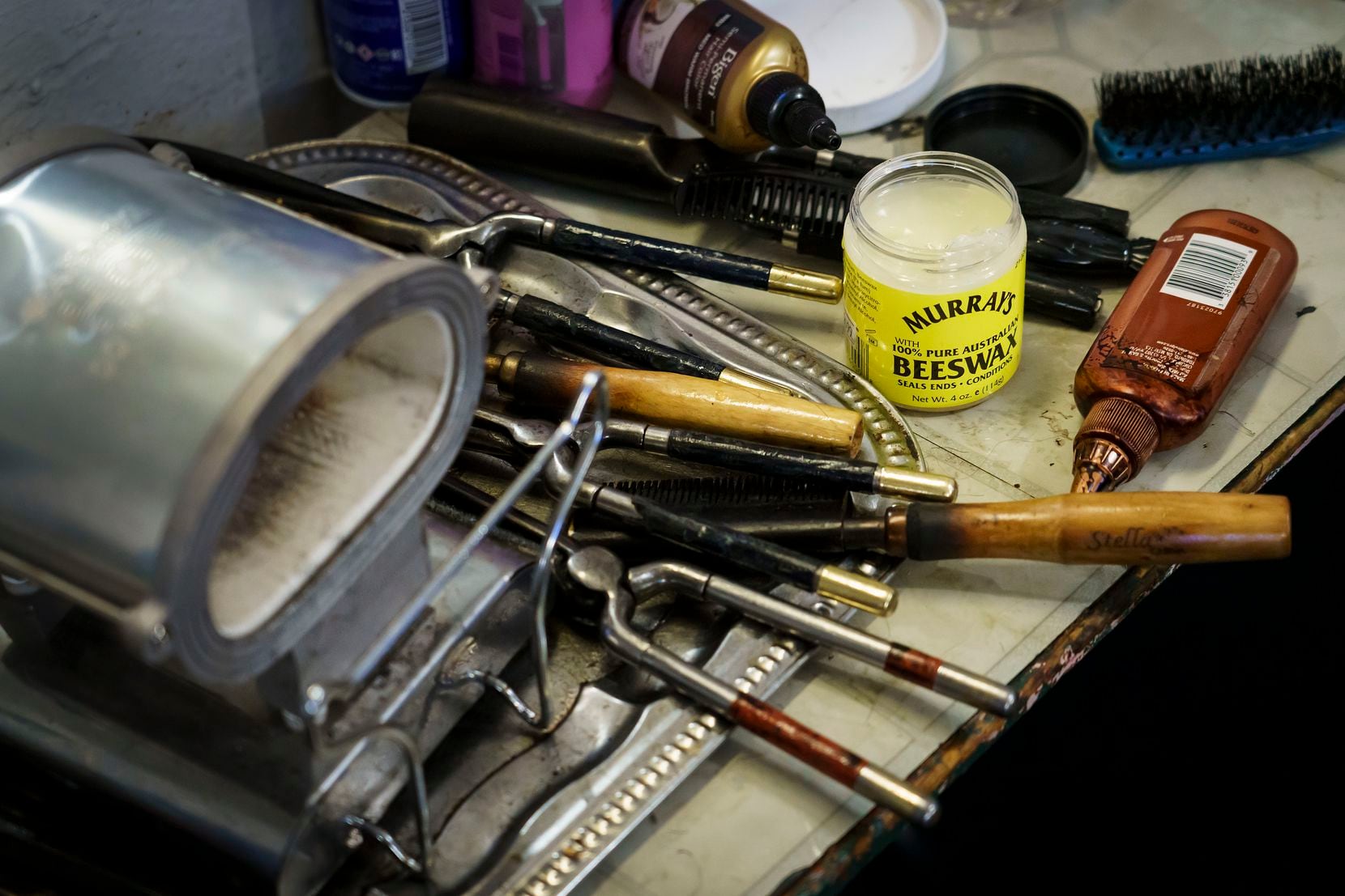 Earnestine Tarrant’s supplies and equipment are seen at her station in her hair salon on her final day working before her retirement.
