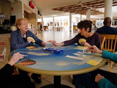 Betty Duke-Ruhd (left) and Connie Hooper (right) of Plano play bridge with friends in the...