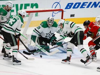 A loose puck in front of the Dallas Stars net moments before Chicago Blackhawks score in the...