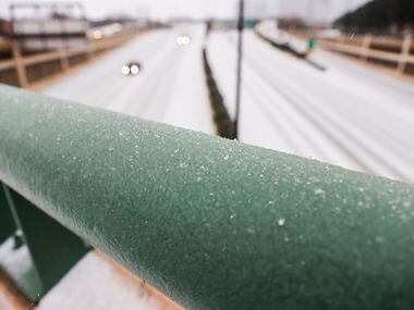 Traffic on US-75 near downtown as sleet falls over the Dallas metroplex on Tuesday, Jan. 31,...