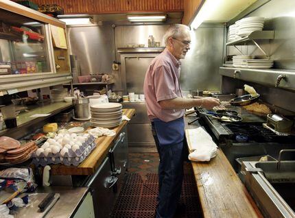 McKinney restaurateur Bill Smith takes a turn at the cooktop in 2006, when his family...