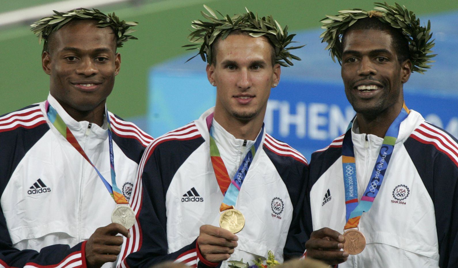 2004 Summer Olympic Games (L-R): Otis Harris (silver), Jeremy Wariner (gold) and Derrick...