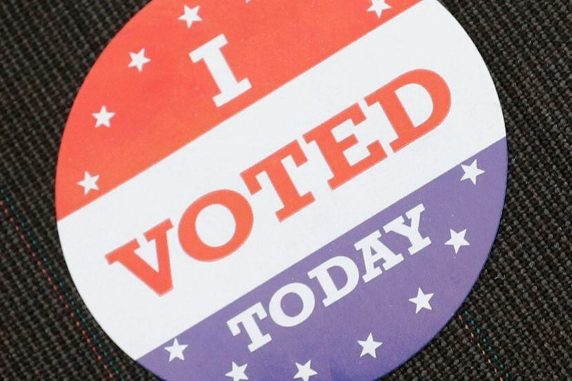 A voter wears a "I VOTED TODAY" sticker